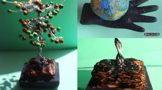 Mano con globo terráqueo – árbol de alambre en pedestal tallado